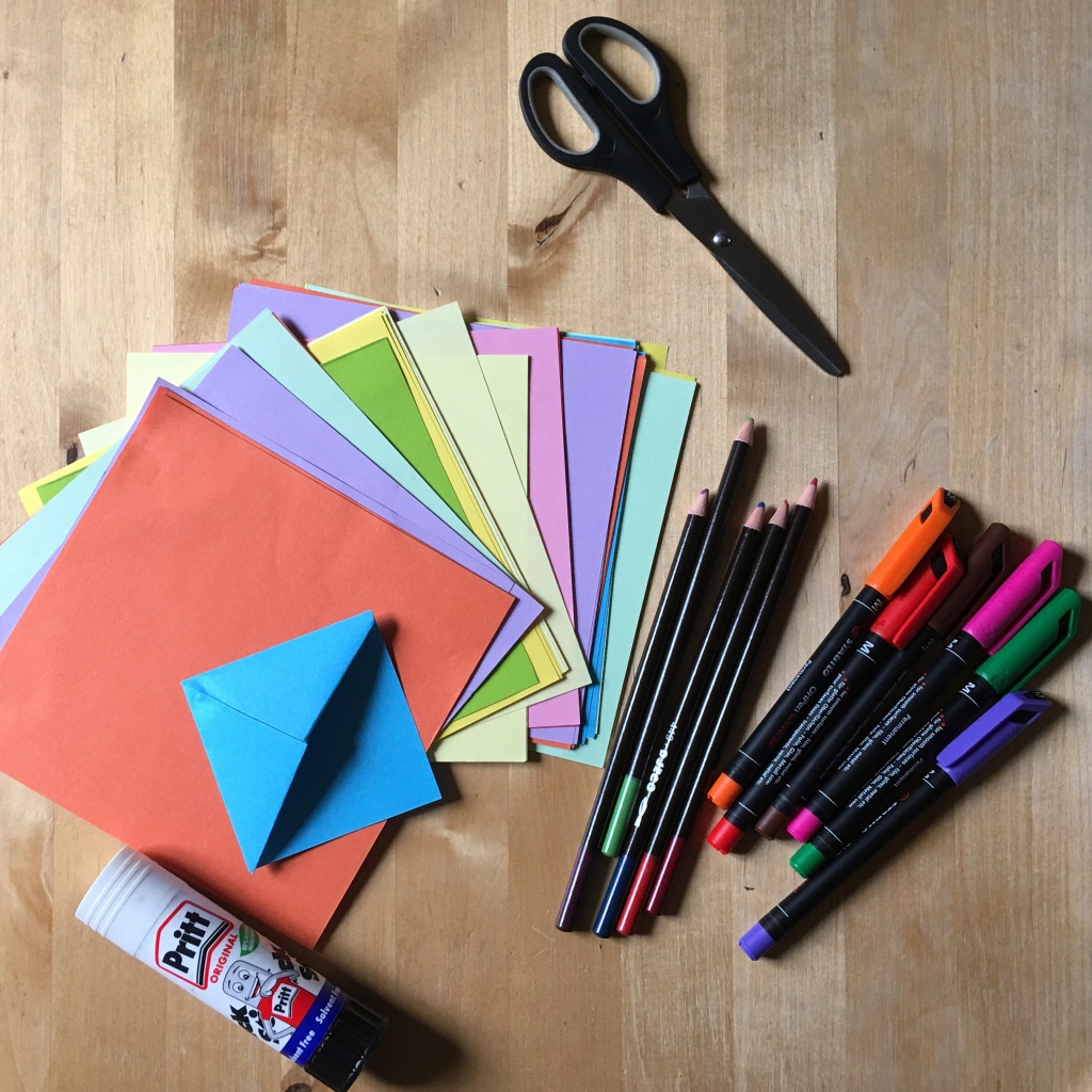 Craft materials: scissors, glue, coloured paper, pencils and pens